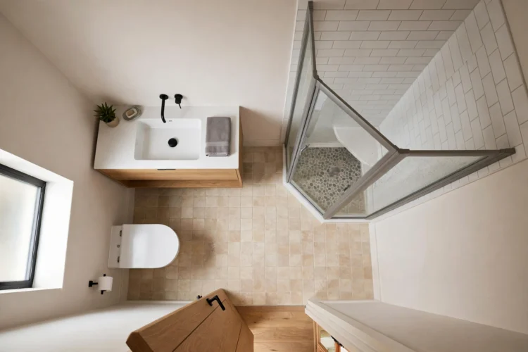 Small bathroom floor plan with corner shower and wall-hung vanity